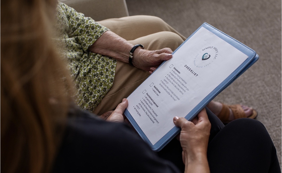 A Simply Shift client reviewing her move checklist